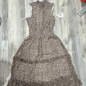 Brand new with tags, medium sized flowy dress. Perfect for any occasion.